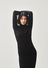 Nice black dress with long sleeves and a high neck. Tanner dress is in a nice cotton/modal quality and has a slim fit. A basic must-have in your wardrobe.