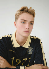 Football jersey made in collaboration with the Danish football team Brøndby Women. The 1971 Polo in navy with yellow details features a loose fit, with a placket closure and collar, as well as long sleeves that have ribbed cuffs. The polo features Brøndby Women and Modström logos on the chest.