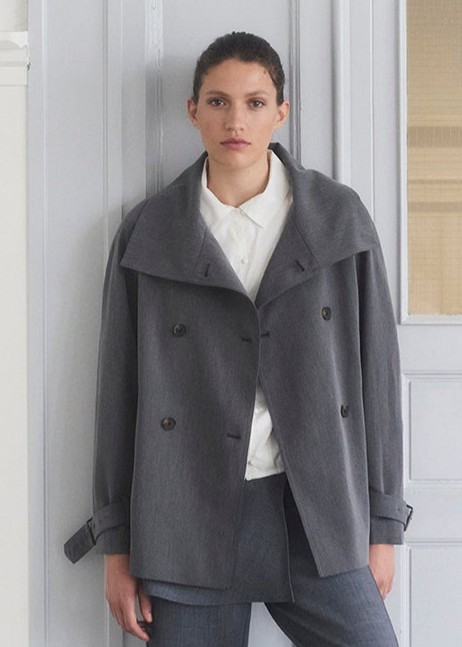 Loose double breasted jacket with button closure. MorganMD jacket has a high neck and wide sleeves with adjustable straps.