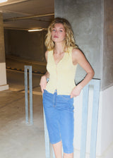 Sleeveless lace top in yellow with a v-neck. MamumdMD top is fitted and has a button closure in front.