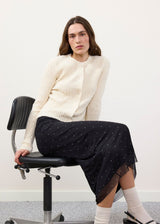 Feminine cardigan with round neck and button closure. The Shellmd cardigan has a timeless cut and soft quality that makes it perfect for layering, and provides an elegant, versatile look.