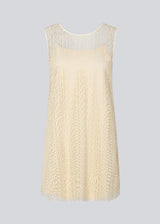 Sleeveless dress in a short length cut from a lace material. DionaMD dress has a round neck in front and a deep neckline in the back. The model is 177 cm and wears a size S/36.