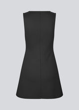 Fitted black mini dress in an A-line shape with a round neck and no sleeves. JosefineMD tank flare dress is made from a stretchy material. The model is 177 cm and wears a size S/36.