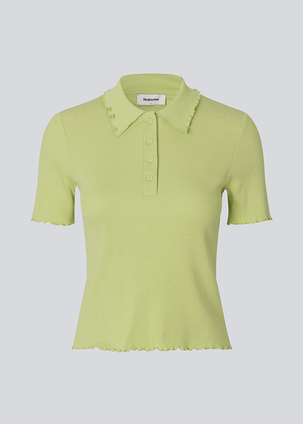 Fitted green polo in jersey. MagdaloneMD polo has short sleeves and babylock edges. 