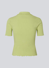 Fitted green polo in jersey. MagdaloneMD polo has short sleeves and babylock edges. 