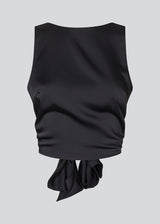Sleeveless top in satin in dark navy blue. TailorMD top has an open back with a tieband.