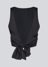 Sleeveless top in satin in dark navy blue. TailorMD top has an open back with a tieband.