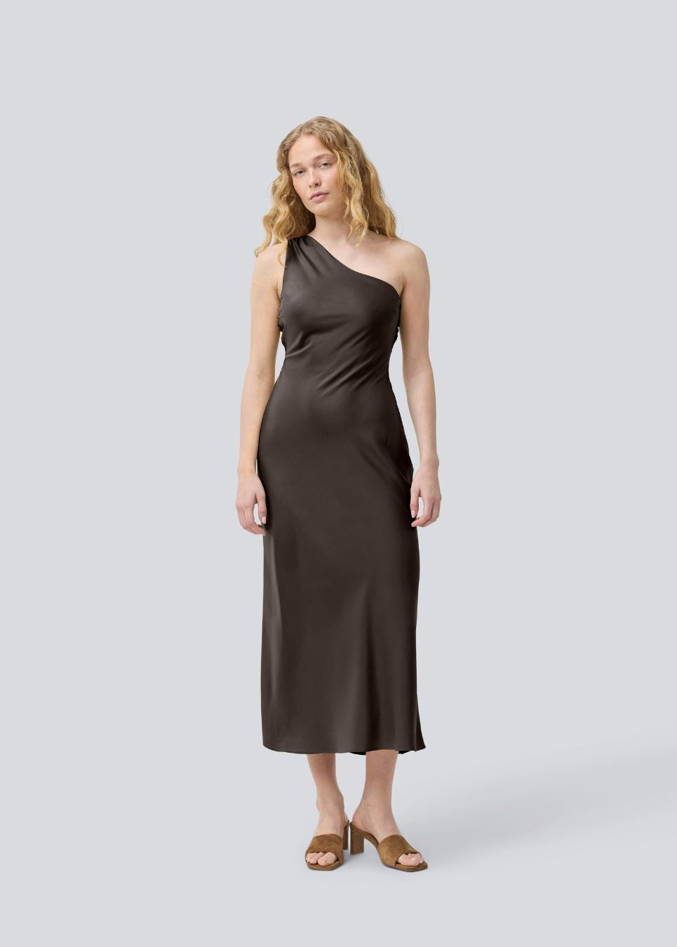 Dark brown maxi one-shoulder dress in satin. NarcissaMD dress has an open back with beautiful details and an invisible zipper on the side.