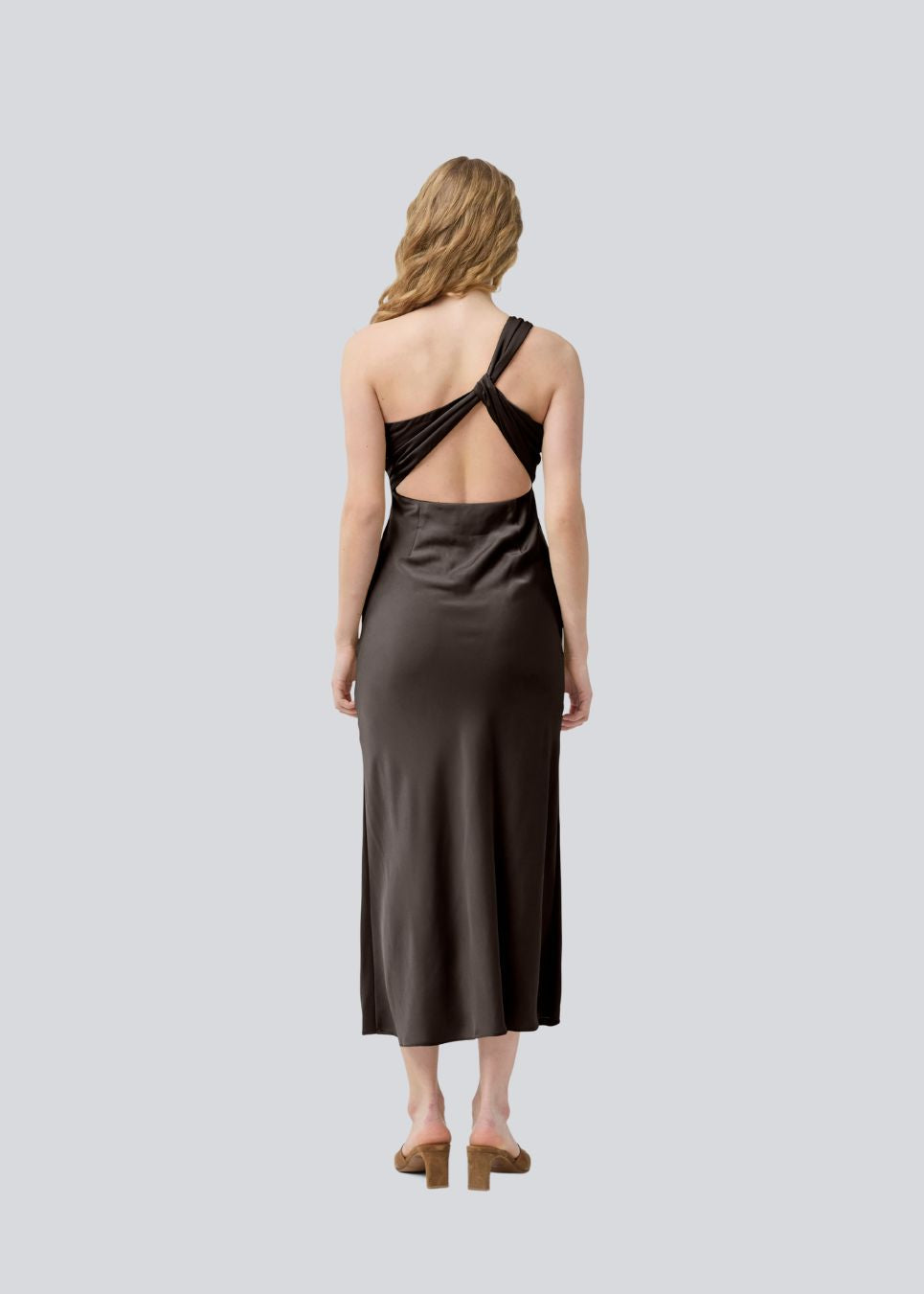 Dark brown maxi one-shoulder dress in satin. NarcissaMD dress has an open back with beautiful details and an invisible zipper on the side.