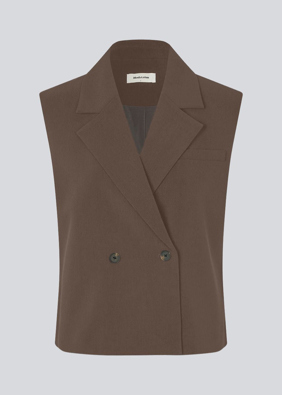Loose vest with a collar in our classic gale material. Galemd vest is sleeveless and has a front button closure