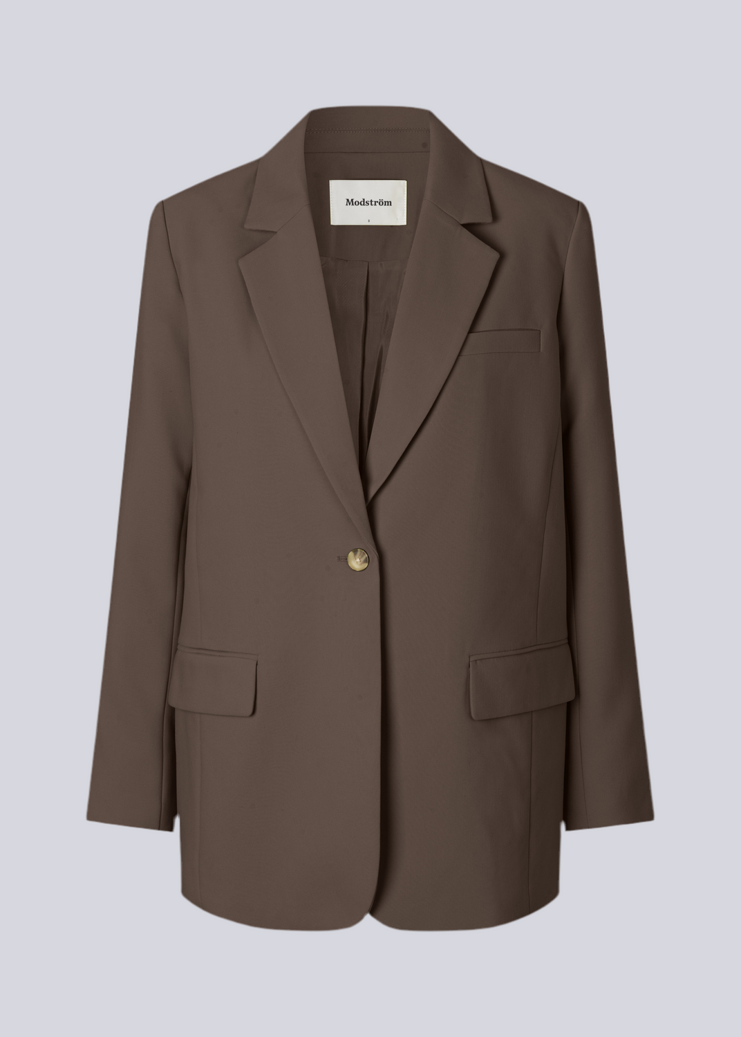 Gale blazer in dark brown has a classic and elegant design, fulfilled by the beautiful revers collar and a long fit. The blazer has a button closure at the front and a chest pocket on the left side.  Buy matching pants: Gale straight pants or Gale Pants in the same color to complete the look.