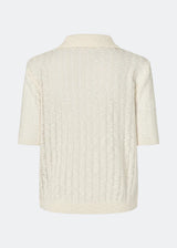 Short-sleeve polo in a sheer knit pattern. The AgnesMD SS Polo features classic details such as a collar, buttons, and ribbed edges. A modern and feminine polo that combines lightness with timeless design.