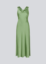 Long dress in lustrous satin with an open back. The AijaMD Dress features a feminine design with a beautifully draped skirt, a fitted waist, draping at the bust, and an elegant crisscross back. Made from 100% recycled polyester, it’s perfect for both evening and party looks.