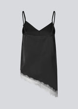 Satin slip top with contrast lace trim. The AlinkaMD Top features spaghetti straps, a V-neckline, and an asymmetrical hem that is longer on one side. An elegant top, perfect on its own or for layered styling.