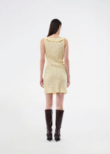 Feminine mini dress with a summery floral print. The AlyssaMD Print Dress is sleeveless and features a V-neckline with a ruffle trim and bow detail. The dress is fitted at the waist and has a beautifully flowing skirt, creating a feminine and elegant look.