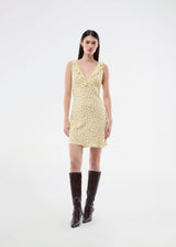 Feminine mini dress with a summery floral print. The AlyssaMD Print Dress is sleeveless and features a V-neckline with a ruffle trim and bow detail. The dress is fitted at the waist and has a beautifully flowing skirt, creating a feminine and elegant look.