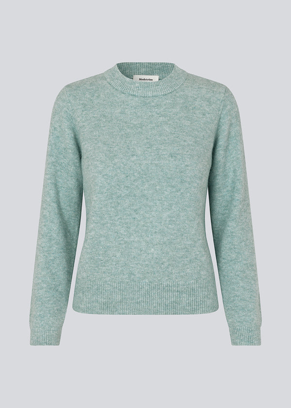 Fine knit jumper in light blue in a more responsible quality. AnnaMD o-neck has a slim silhouette with long sleeves and round neck. Ribknitted trimmings.  The model is 177 cm and wears a size S/36.