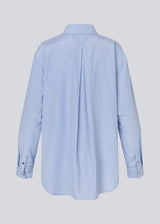 Long shirt with pinstripes. The BalouMD Shirt features unique silver buttons, a collar, cuffs, and a longer back hem - a sleek and modern statement top, made from 100% recycled polyester.