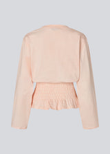 Long-sleeve T-shirt with smocked waist detail. The BariMD LS T-Shirt features a logo on the front, a round neckline, and combines a sporty look with feminine, flattering details - a trendy and effortless everyday favorite.