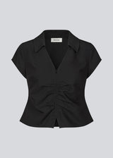 Feminine, tailored top. The BeamMD Top features a shirt collar, short sleeves, a V-neckline, and a front zip closure with gathered detailing - a flattering and trendy style, perfect for taking you from day to night.