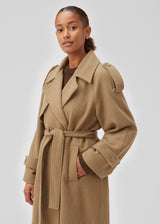 Coat in Dune in trenchcoat style with an oversized silhouette. BorakMD coat is double-breasted with a collar, open yoke, belt at the waist, and a slit in the back. Woolen quality. Lined.