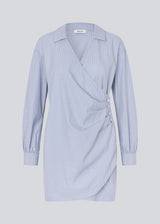 Short asymmetric dress with shirt-inspired details. The BrodieMD Dress features a collar, V-neckline, cuffs, and a wrap-style detail with buttons and pleats - a trendy and flattering style that creates a modern, effortless look.