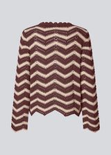 Our very popular crochet sweater is back! Now in a new season color!
Jumper in crocheted style made from soft organic cotton. CaryMD o-neck has a relaxed fit, a round neck, wavy hem, long wide sleeves, and detailed finishes. The color is beige and burgundy stripes. 