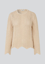Jumper in crocheted style made from a soft organic cotton. CaryMD o-neck has a relaxed fit with a round neck with wavy hem, long wide sleeves and detailed finishes. The model is 175 cm and wears a size S/36.