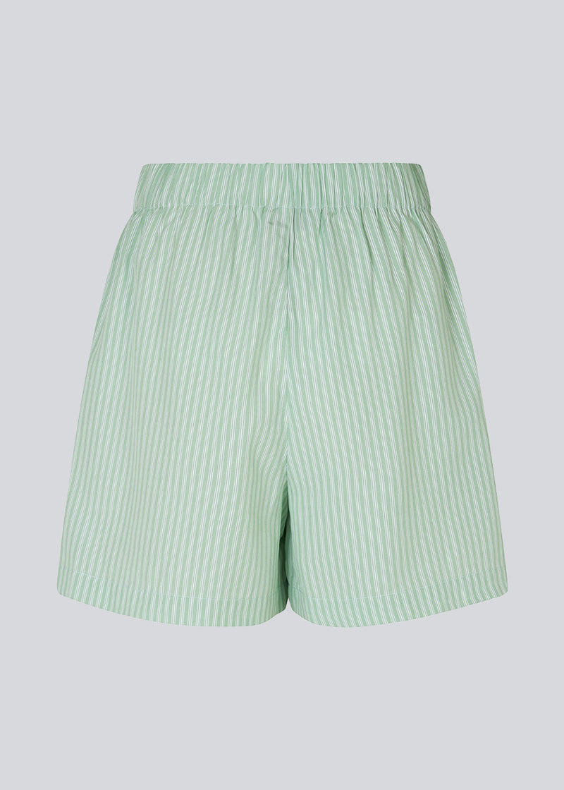 Striped shorts in a cotton blend material with a relaxed shape, wide legs, and an elasticated waist. DannyMD shorts feature a small embroidered logo in front. The model is 177 cm and wears a size S/36.  Shop matching shirt: DannyMD shirt.