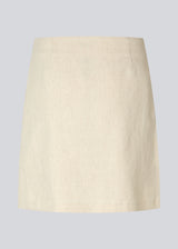 Short skirt with a medium waistline. DaynaMD skirt is made with a slim fit with wrap-over detail with a small slit in front and zipper at the side. The model is 177 cm and wears a size S/36.