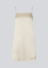 Short dress in satin with lining. DevanMD dress is designed for a slim fit, straight neckline with thin adjustable straps, and a skirt with a little volume.