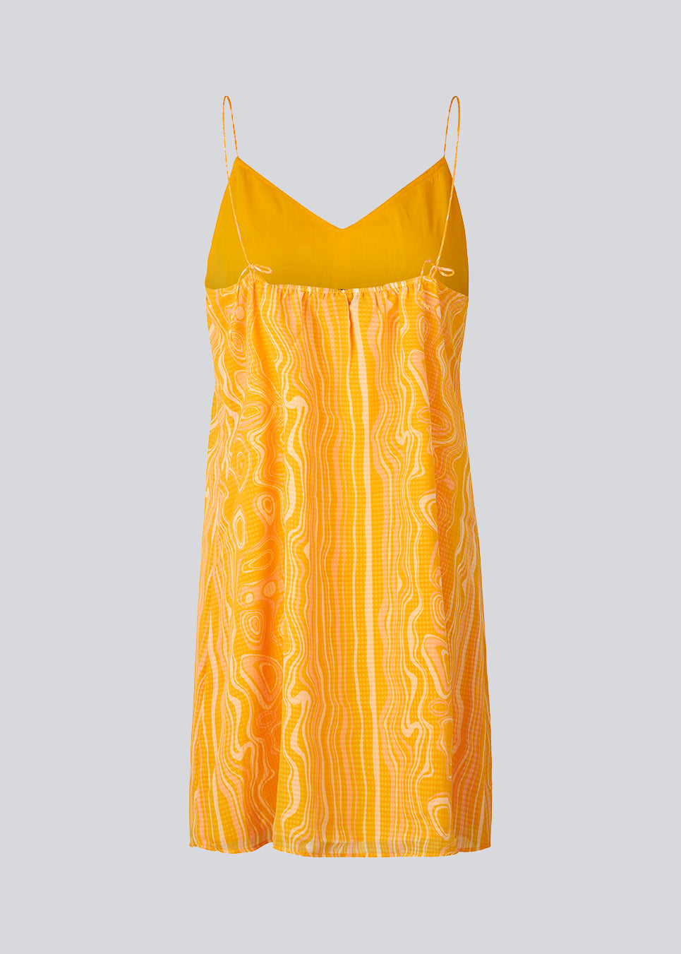 DonteMD print strap dress is a short dress with a slim fit, a v-neckline, ruched detail in the back, cutline at the waist, and narrow adjustable straps. Lined. The model is 177 cm and wears a size S/36.