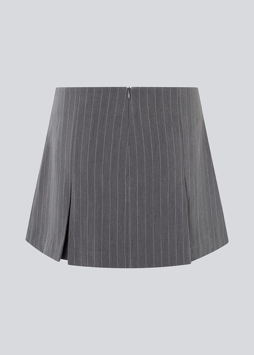Short skirt in grey pinstripe with bows and box pleats. EmiliaMD bow skirt has an invisible zipper at the back and a cute bow detail in front.<br>