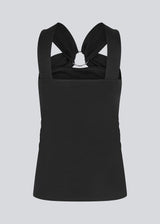 Fitted black top in an elastic material. EmiliaMD top has a detailed metal ring at the chest and wide straps.