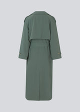 Oversized double-breasted trenchcoat with tie belt at the waist. EvieMD jacket has dropped shoulders and long, wide sleeves. Lined.