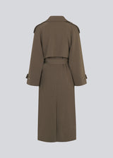 Oversized double-breasted trench coat in dark brown with tie belt at the waist. EvieMD jacket has dropped shoulders and long, wide sleeves. Lined. '
