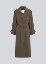 Oversized double-breasted trench coat in dark brown with tie belt at the waist. EvieMD jacket has dropped shoulders and long, wide sleeves. Lined.