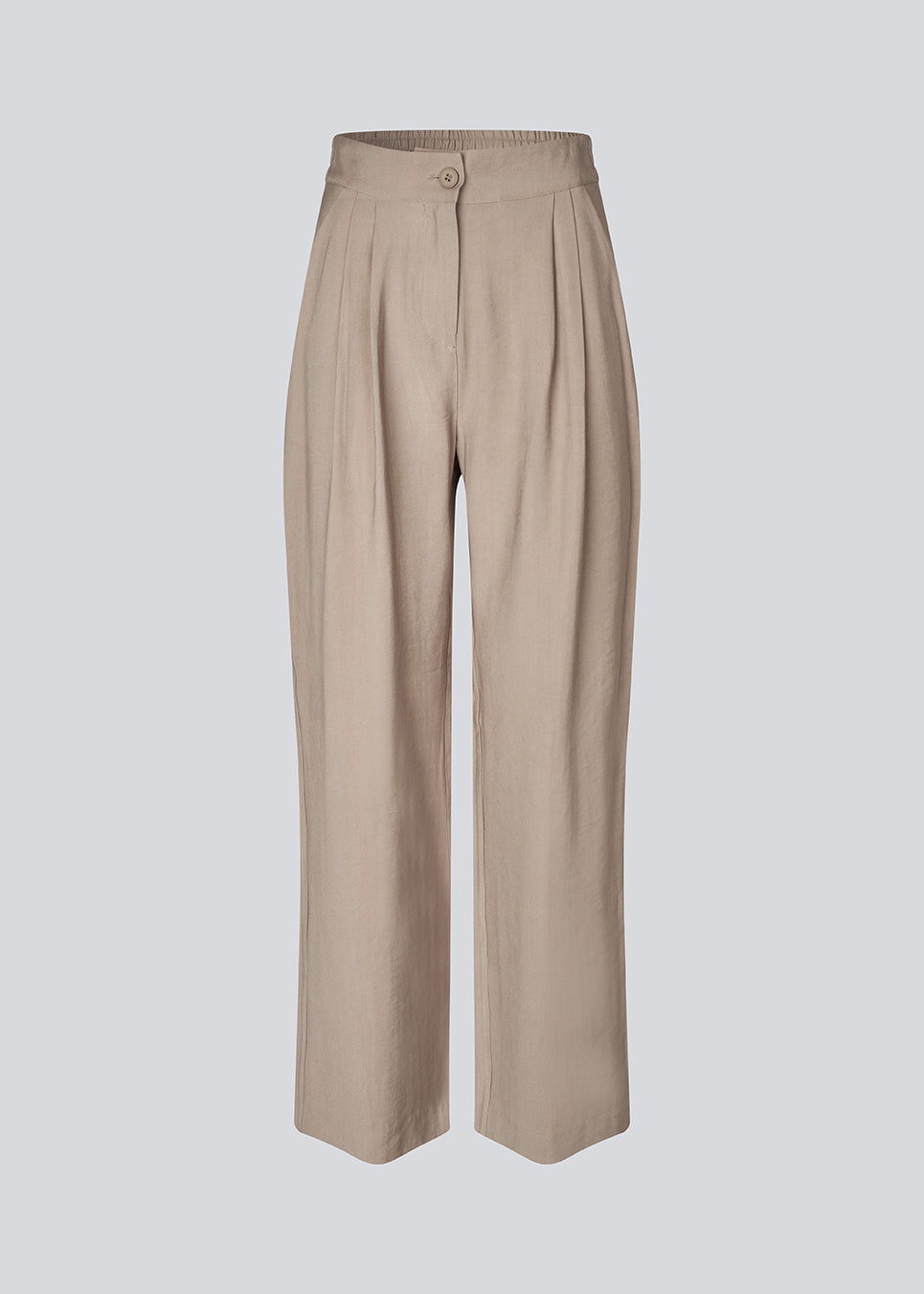 FanyaMD pants have a menswear-inspired look with straight, wide legs, a high waist with zip fly and button and elastication in back. Doubble pleat in front and side pockets.