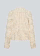 Off white knit with dropped shoulders and long wide sleeves. FelipeMD t-neck has a high neck with ribbed trimmings on the neckline and hem of sleeves. 