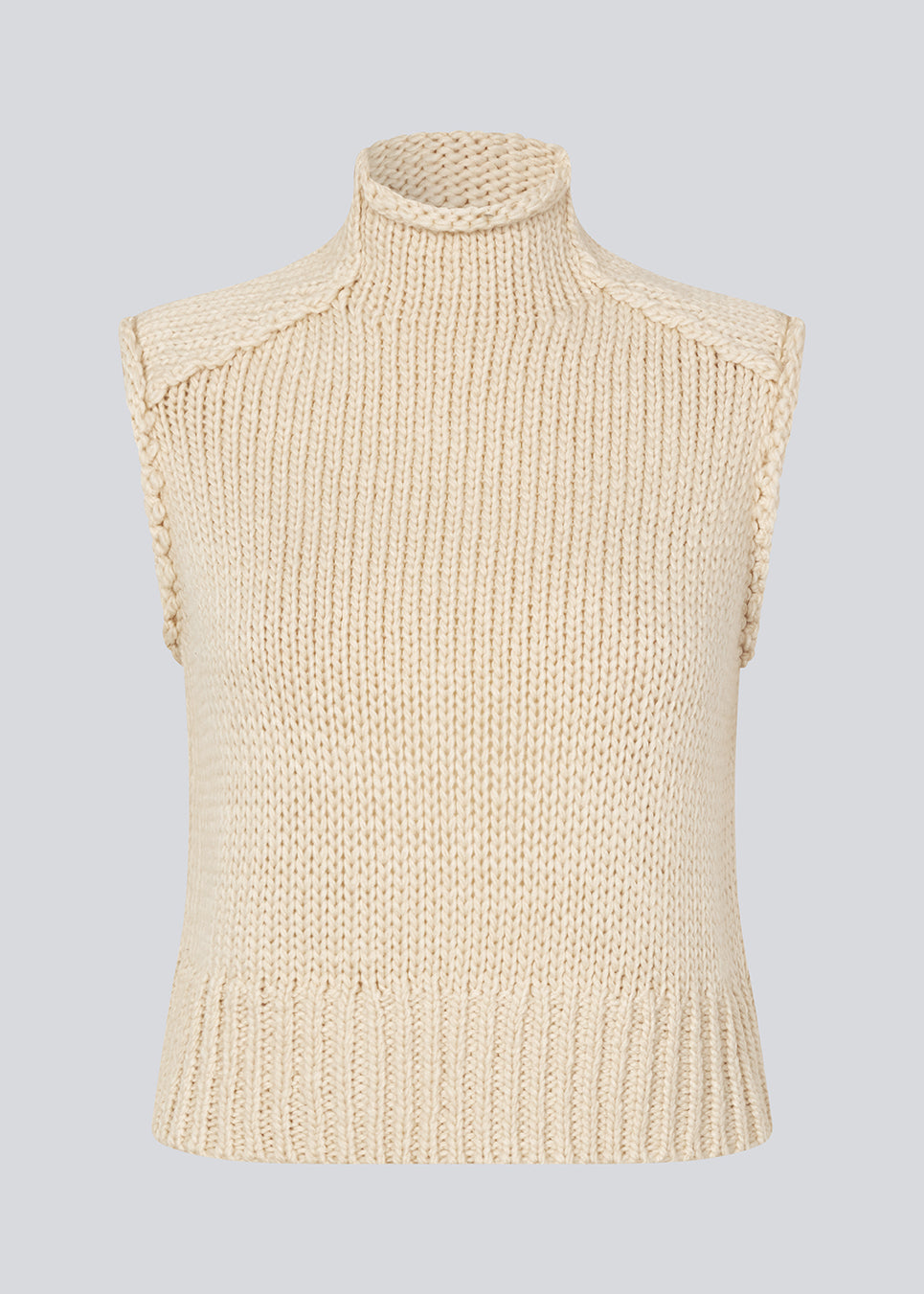 Loose off white sleeveless vest in plain jersey knit. FelipeMD vest is slightly cropped and has a high neck.