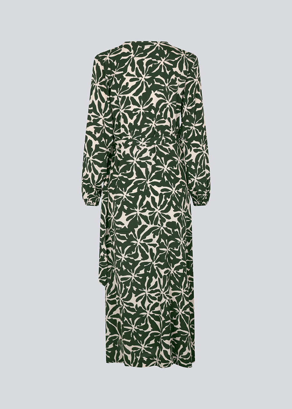 Midi dress in printed EcoVero viscose with v-neckline and wrap detail in front. FernMD print wrap dress has a wide tie belt at the waist and long balloon sleeves. The model is 175 cm and wears a size S/36.