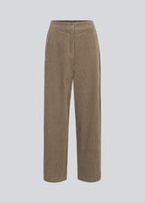 Corduroy pants in beige with long, wide legs and a high waist with zip fly and button, and elastic on the back. FikaMD pants are lined.