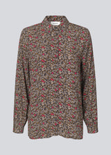 Relaxed shirt in a light, woven quality made from EcoVero viscose. FloryMD print shirt has collar and buttons in front and long wide sleeves with cuff. The model is 175 cm and wears a size S/36.