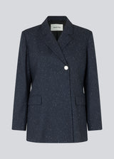 Oversized double-breasted blazer with a single visible button. FolaMD blazer is designed in a wool blend with small colored flecks. Part of set, buy the pants here: FolaMD pants. The model is 175 cm and wears a size S/36.
