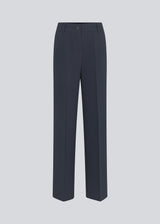 Gale pants in midnight blue have a classic design. The pants have straight, wide legs with press folds, which creates an elegant look. The model is 177 cm and wears a size S/36.  Style the pants with matching blazer in the same color: Gale blazer.