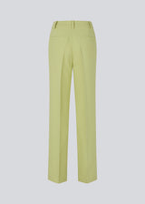 Gale pants in light green have a classic suit design. The pants have straight, wide legs with pressfolds, which create an elegant look. 