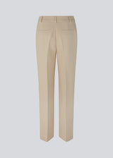 Gale pants in Powder Sand have a classic design. The pants have straight, wide legs with pressfolds, which creates an elegant look.