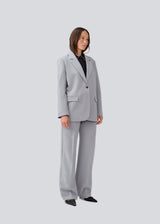 Gale pants has a classic design. The pants has straight, wide legs with pressfolds, which creates an elegant look.
