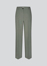 Gale pants in soft green has a classic design. The pants has straight, wide legs with pressfolds, which creates an elegant look. The model is 175 cm and wears a size S/36.<br>