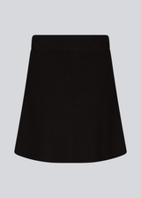 Knitted mini skirt in black in an A-line silhouette with a high waist with covered elasticated. GalenMD skirt is made of organic cotton.